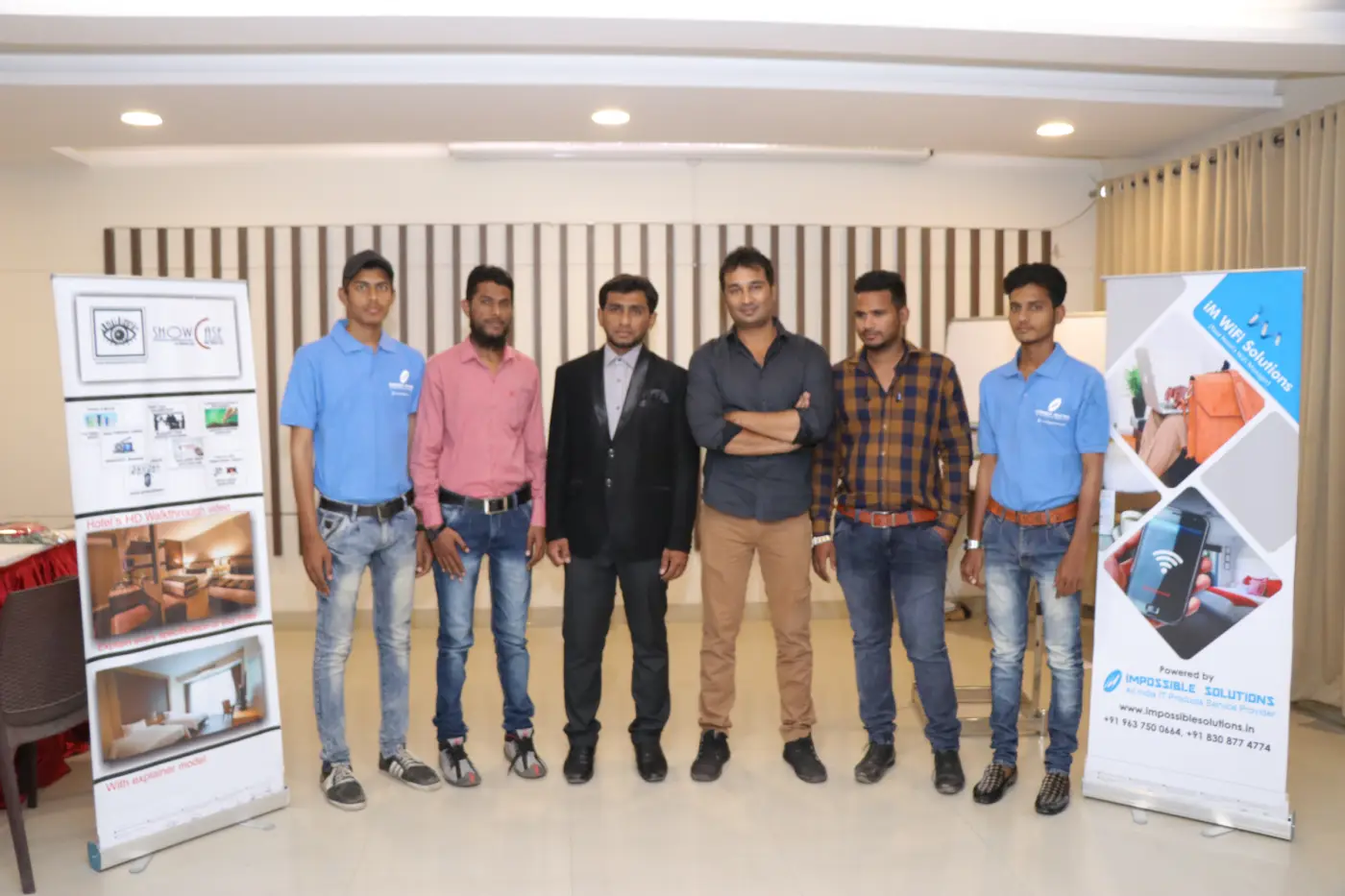 Techno Layers WiFi solutions team at company headquarters in Aurangabad India with iM WiFi Manager and hotel WiFi showcase display